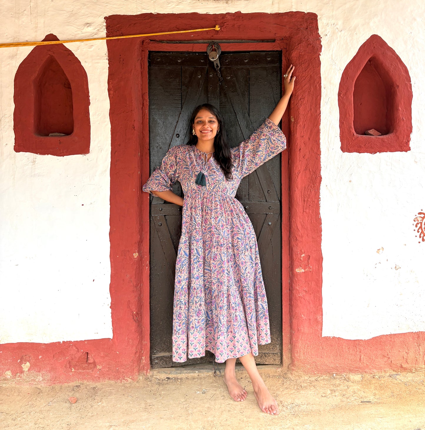 Full view of Deveshi dress showing balloon sleeves and three tiers