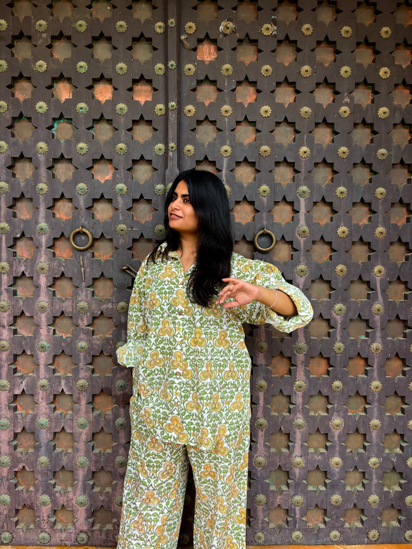 Close-up of yellow cotton shirt with green floral block print pattern