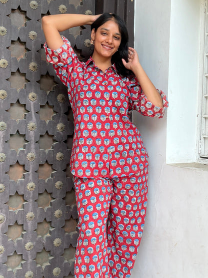 Woman wearing red Rakshita cotton co-ord set with blue floral hand block print