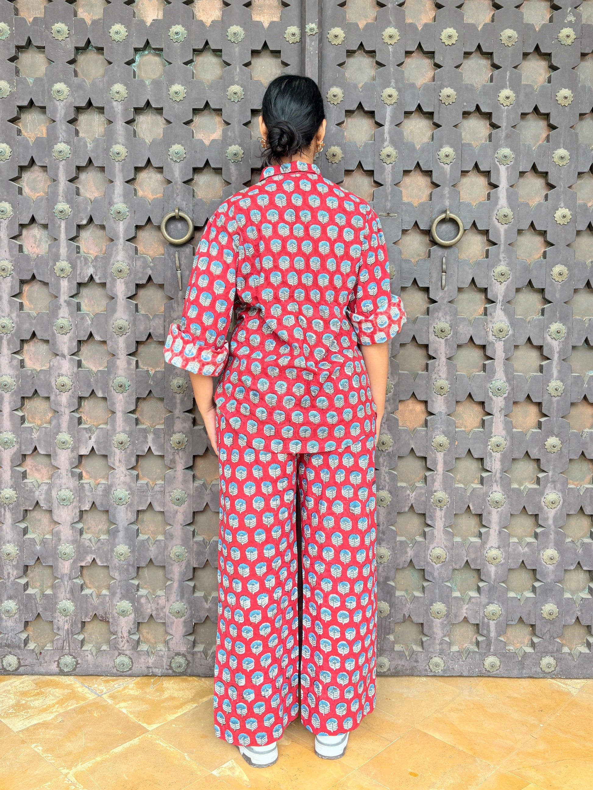 Full view of Rakshita red co-ord set showing relaxed fit and matching pants