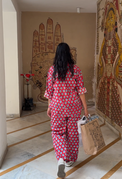 Woman wearing full set red Rakshita cotton co-ord set with blue floral hand block print