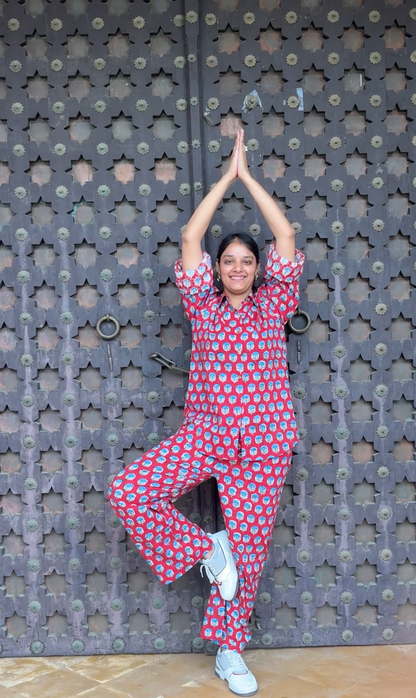 Woman wearing red Rakshita cotton co-ord set with blue floral hand block print