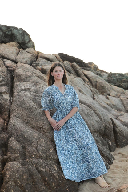 Woman wearing sky blue tiered maxi dress in cotton