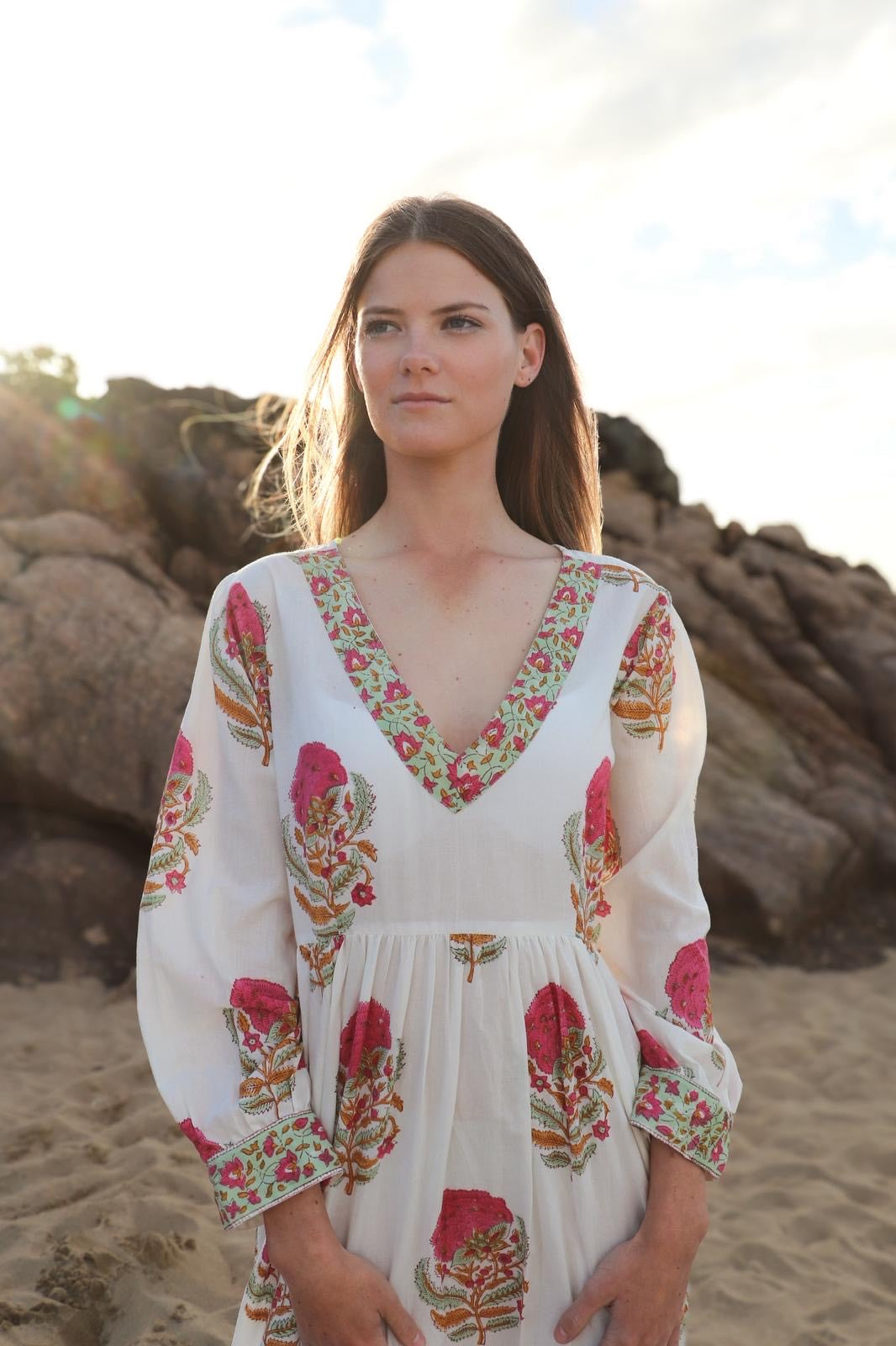 Blush Tale dress showing delicate pink flowers and green leaf motifs