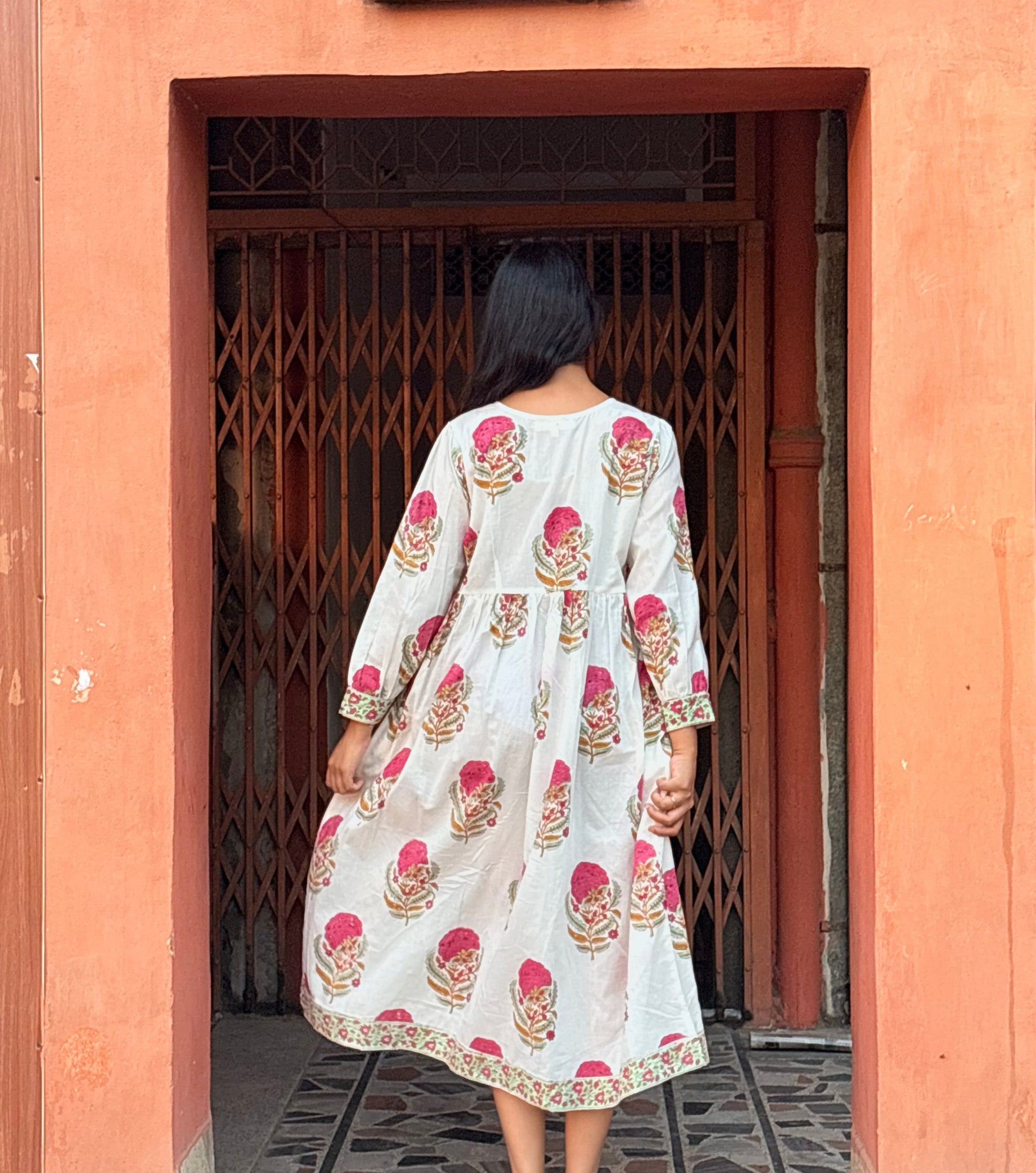 back details of blush tale block printed dress
