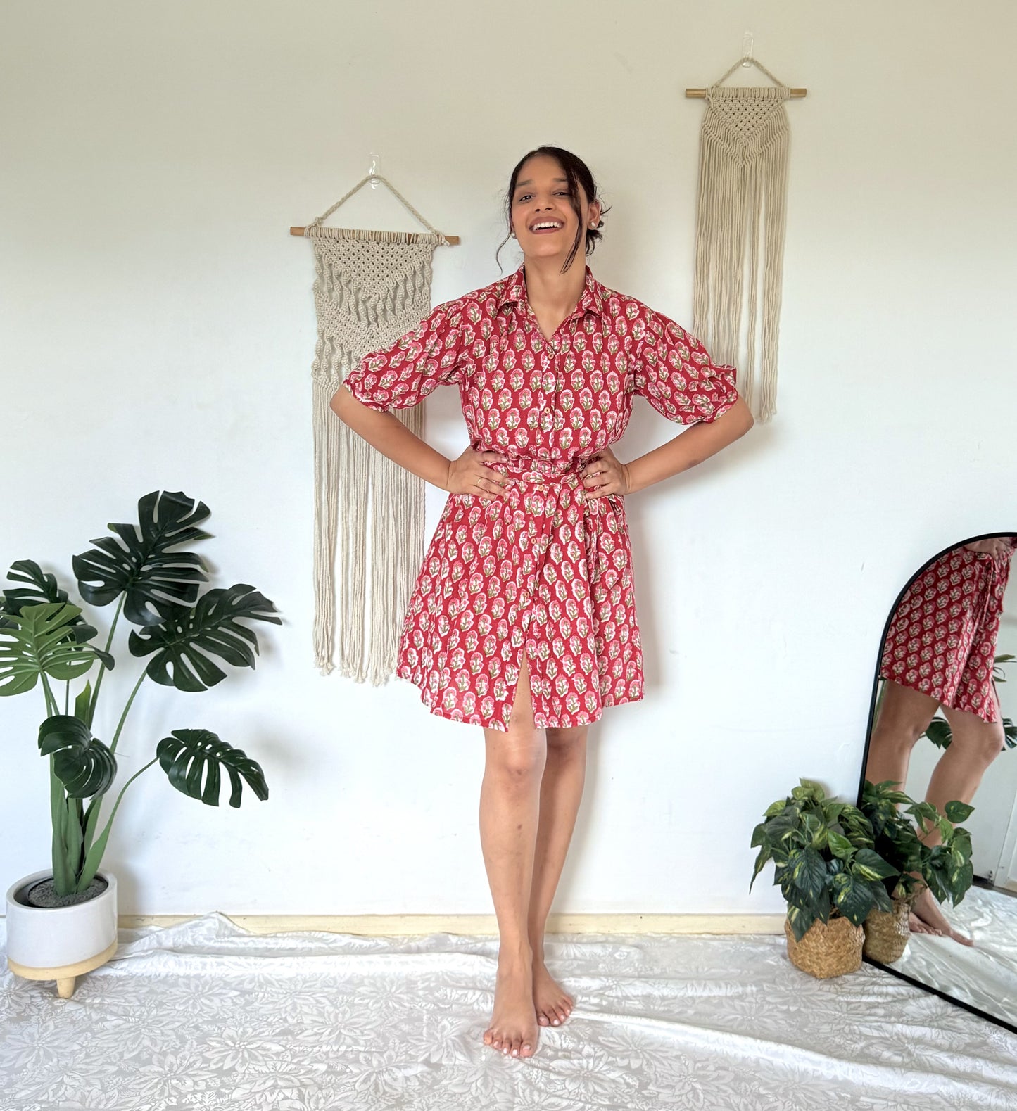 Woman wearing red short dress with button-down front