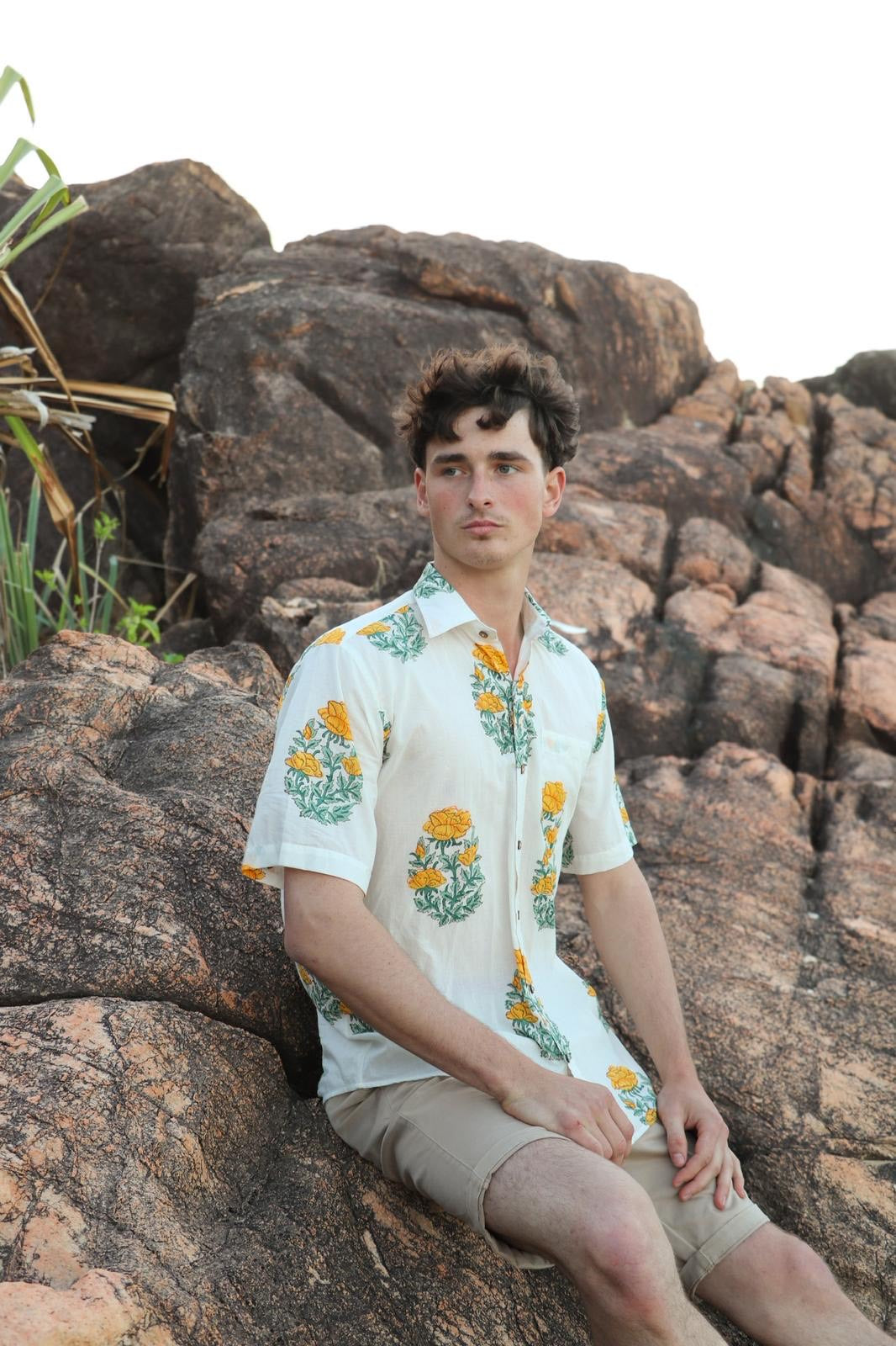 Person wearing yellow handwoven cotton unisex shirt
