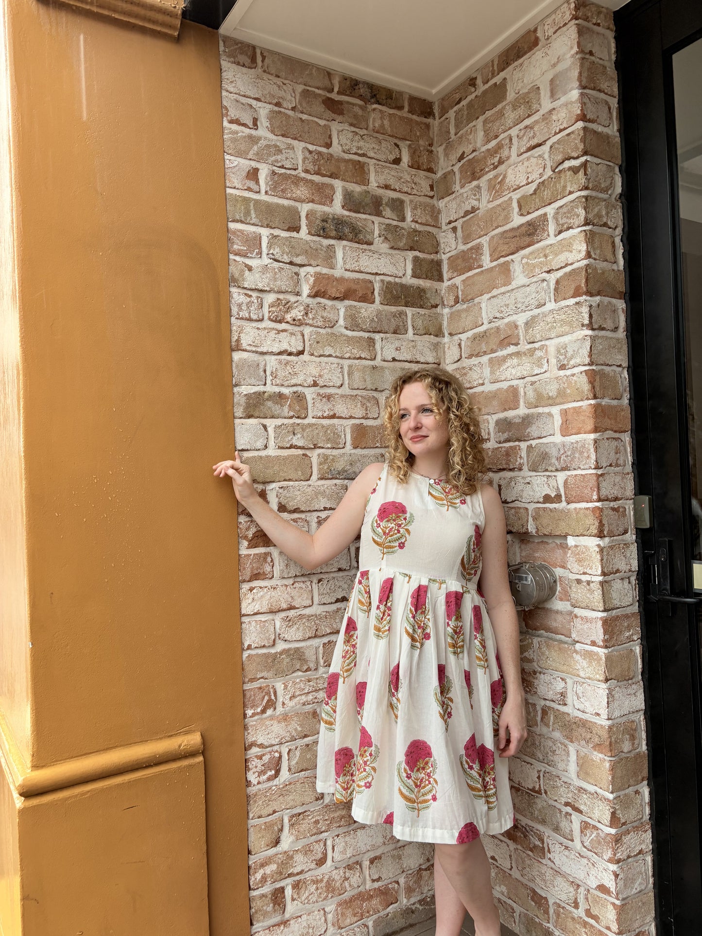 Mughal Bloom short dress showing pink flowers and green leaves