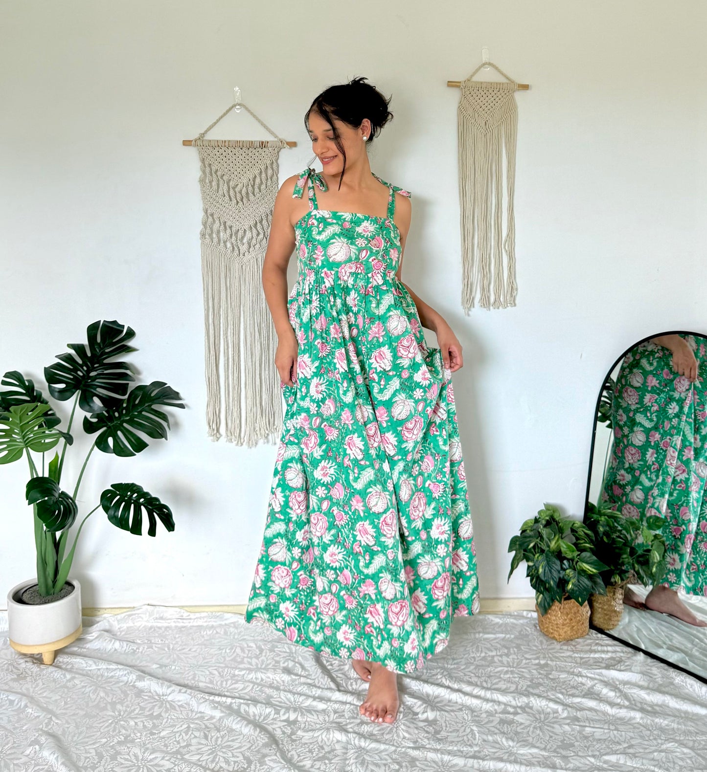 Woman wearing olive green maxi dress with shoulder ties