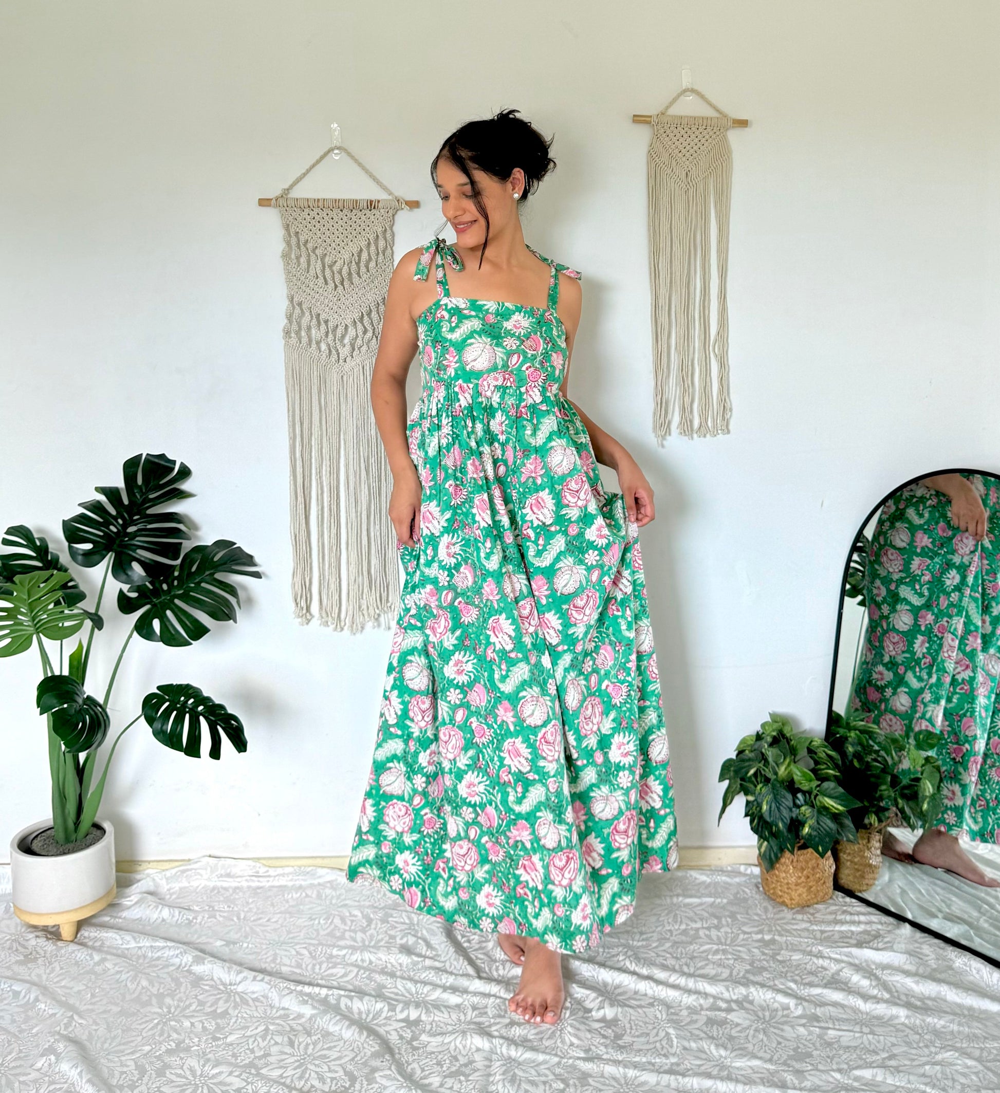 Woman wearing olive green maxi dress with shoulder ties