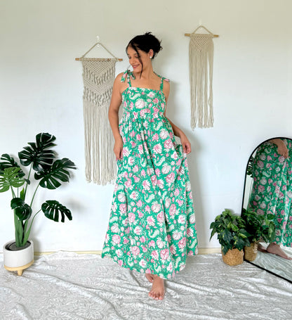 Woman wearing olive green maxi dress with shoulder ties