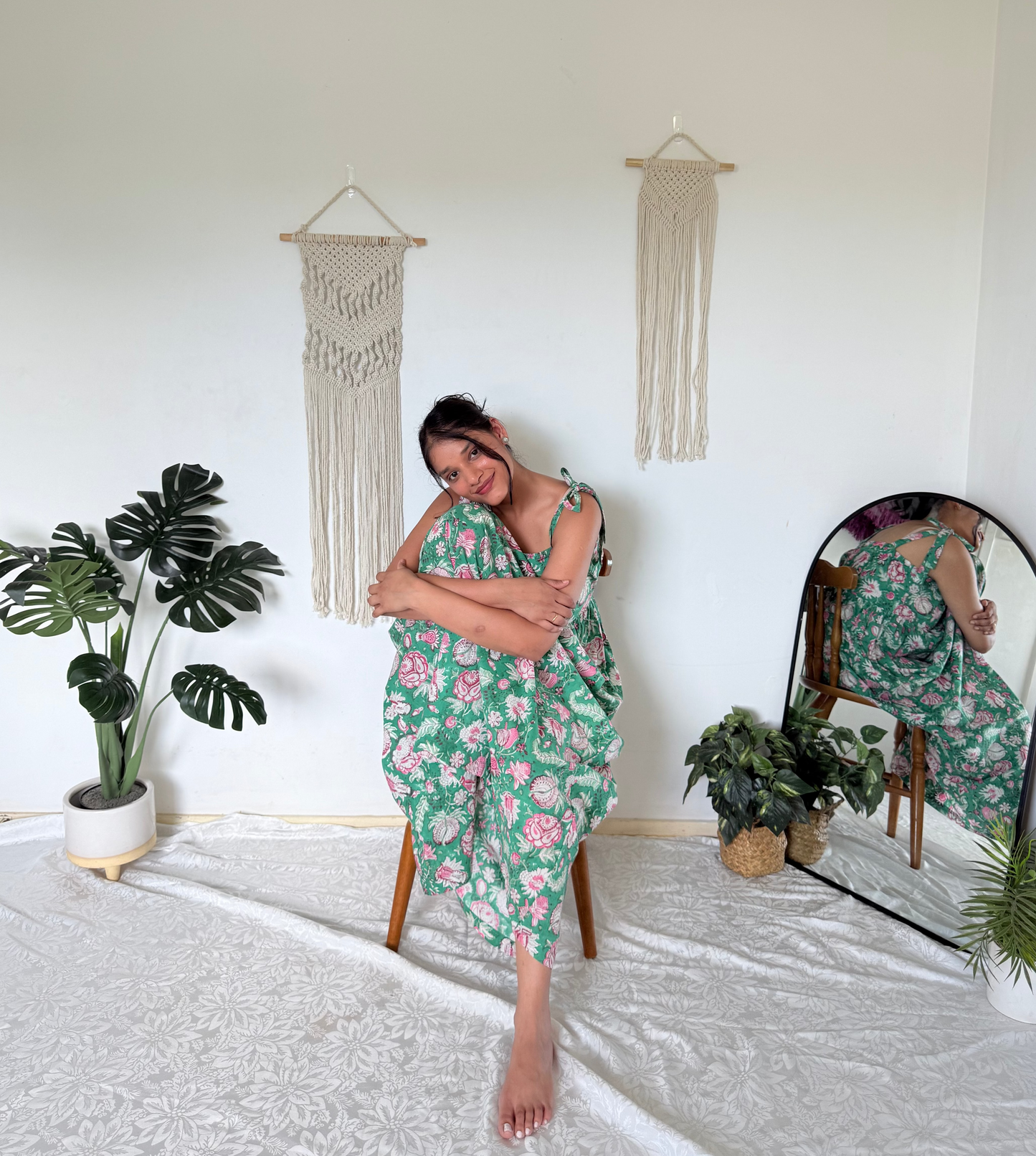 Woman wearing olive green maxi dress with shoulder ties