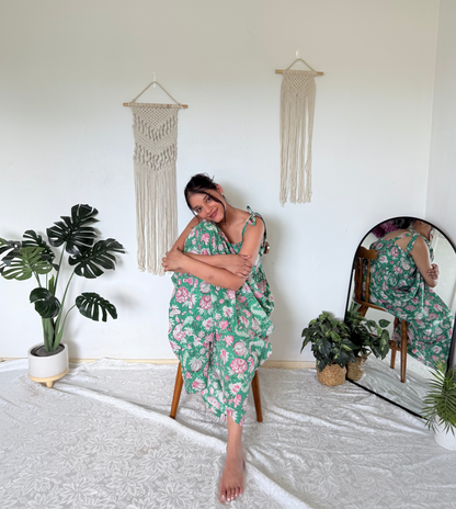 Woman wearing olive green maxi dress with shoulder ties