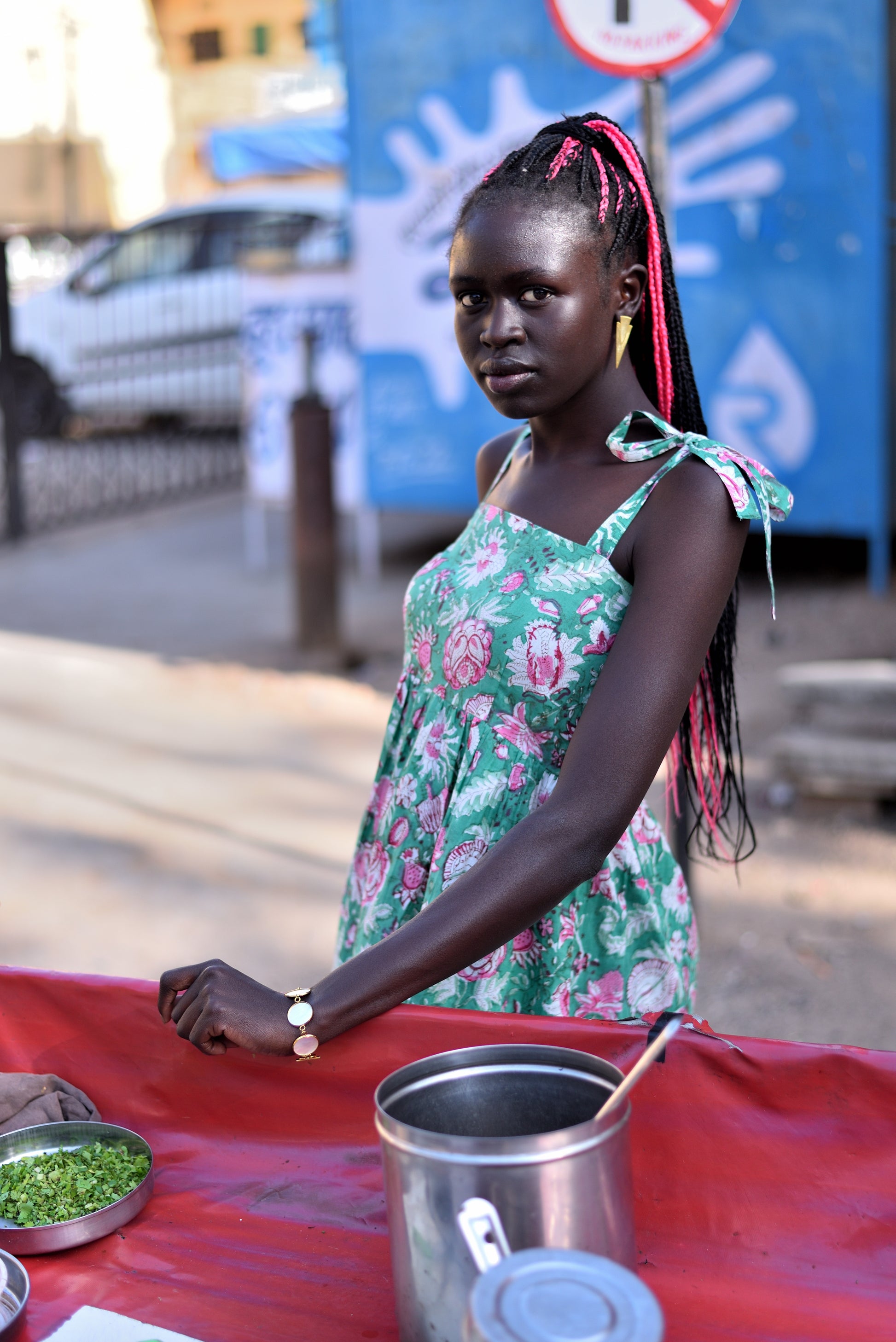 Detail of relaxed fit and flowy silhouette on olive maxi dress