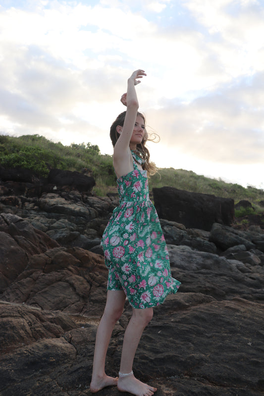 Woman wearing olive green short dress in handwoven cotton