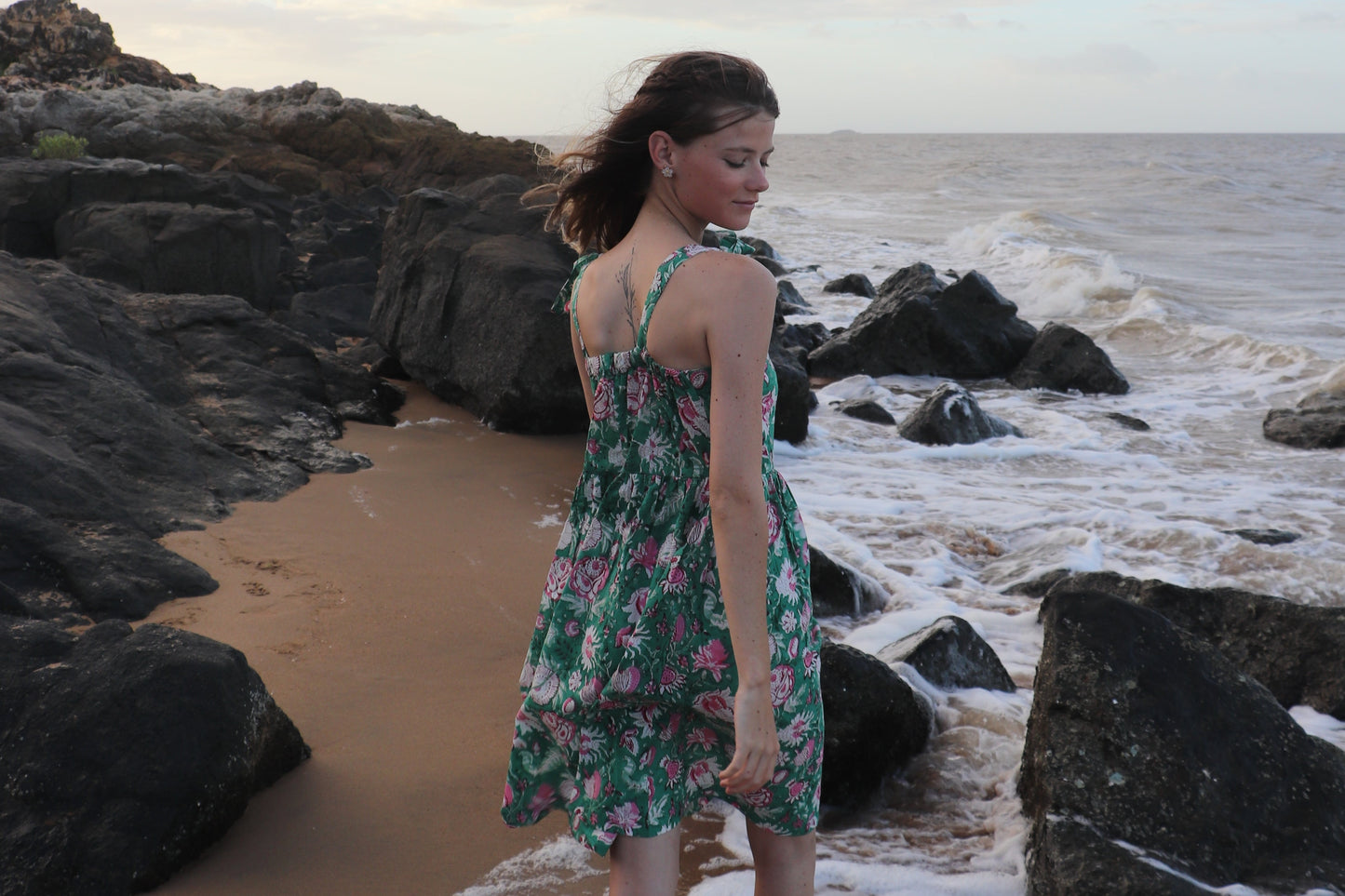 Detail of breezy fit and simple design on olive dress