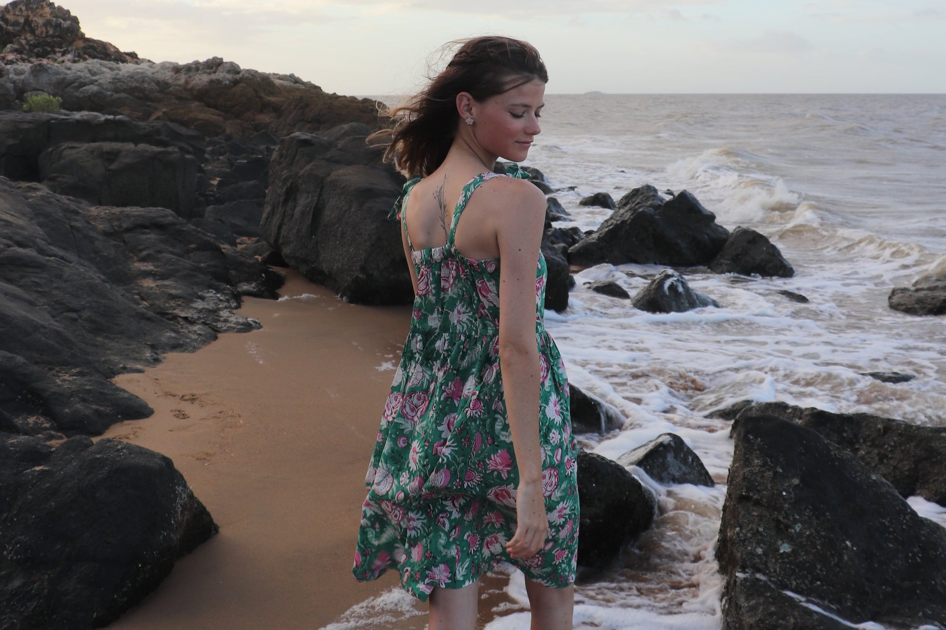 Detail of breezy fit and simple design on olive dress