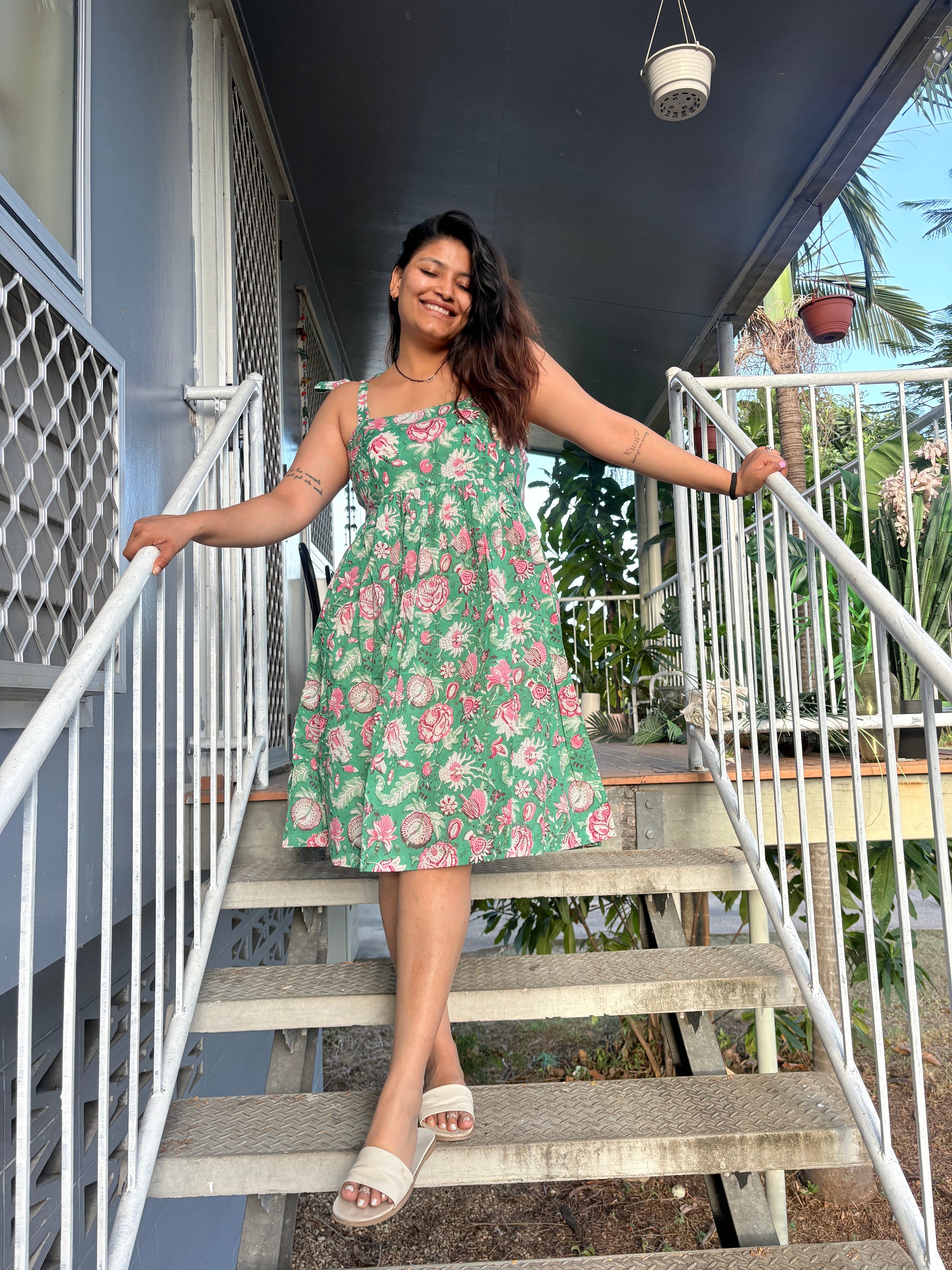 Detail of breezy fit and simple design on olive dress