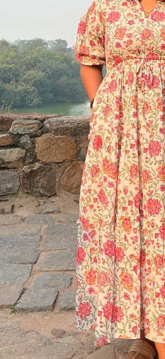 Close-up of pink and green hand block printed floral pattern on cotton dress