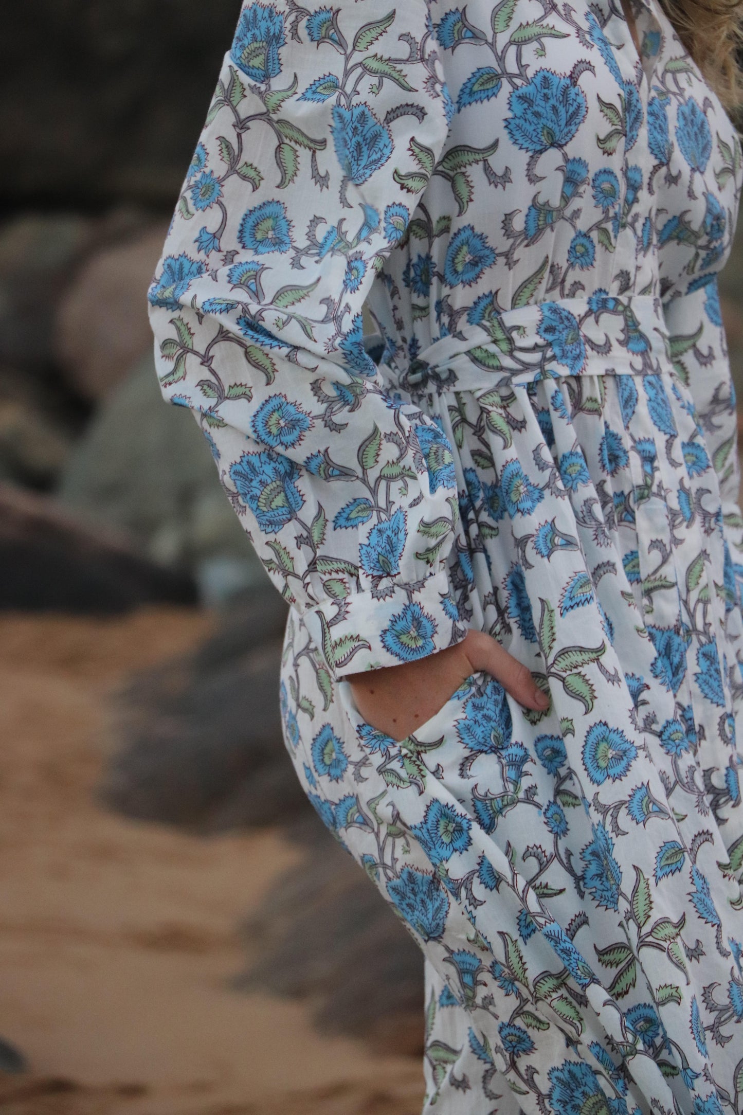 Detail of straight cut and graceful midi length on dress