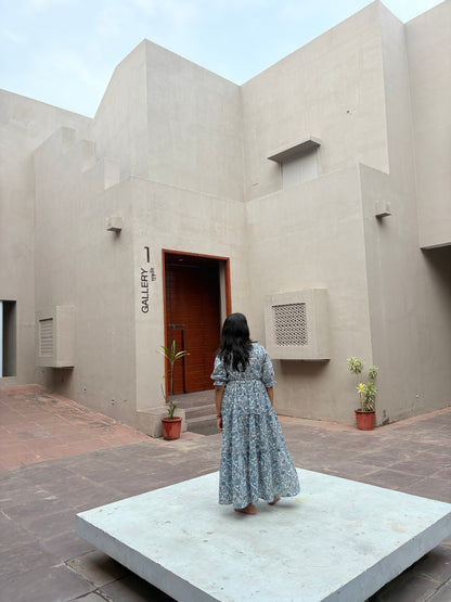 Full length view of sky blue tiered dress with flowy silhouette