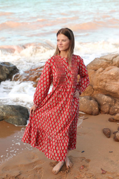Woman wearing red maxi dress with hand block print