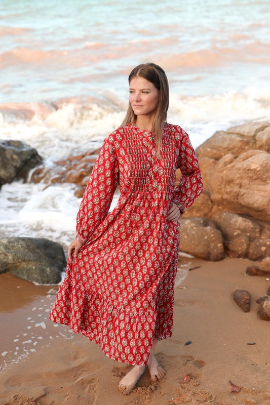 Woman wearing red maxi dress with hand block print