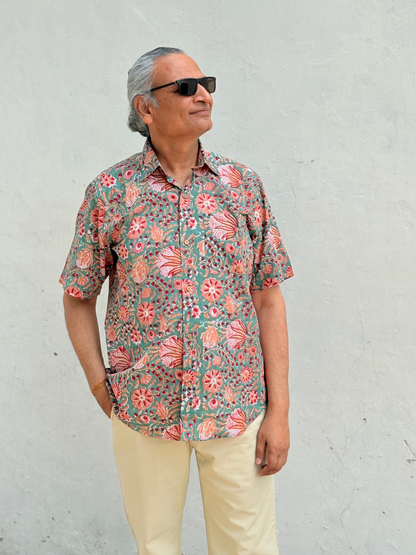 Person wearing green handwoven cotton unisex shirt