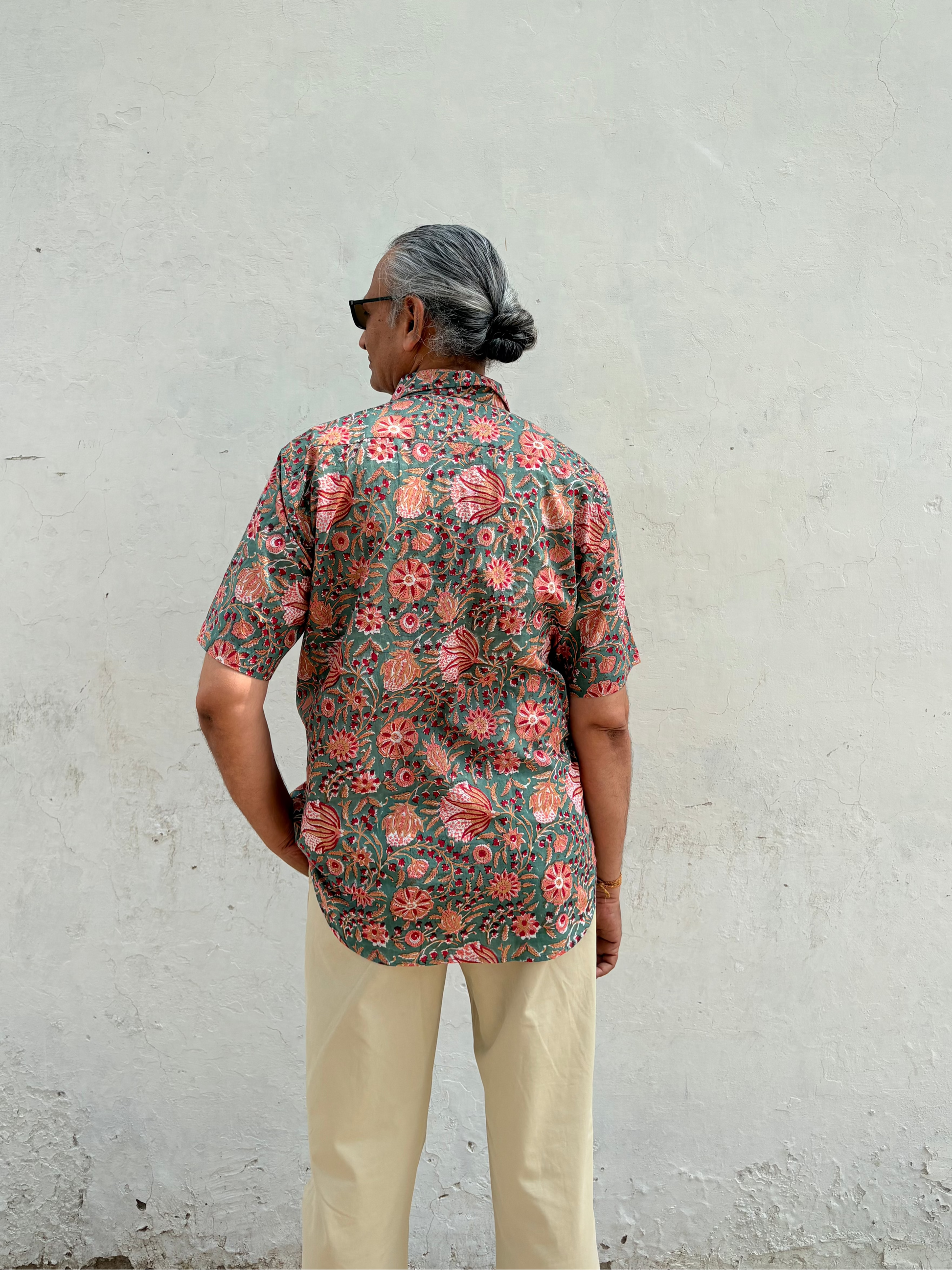 Tropical Tale green shirt showing relaxed fit and half sleeves