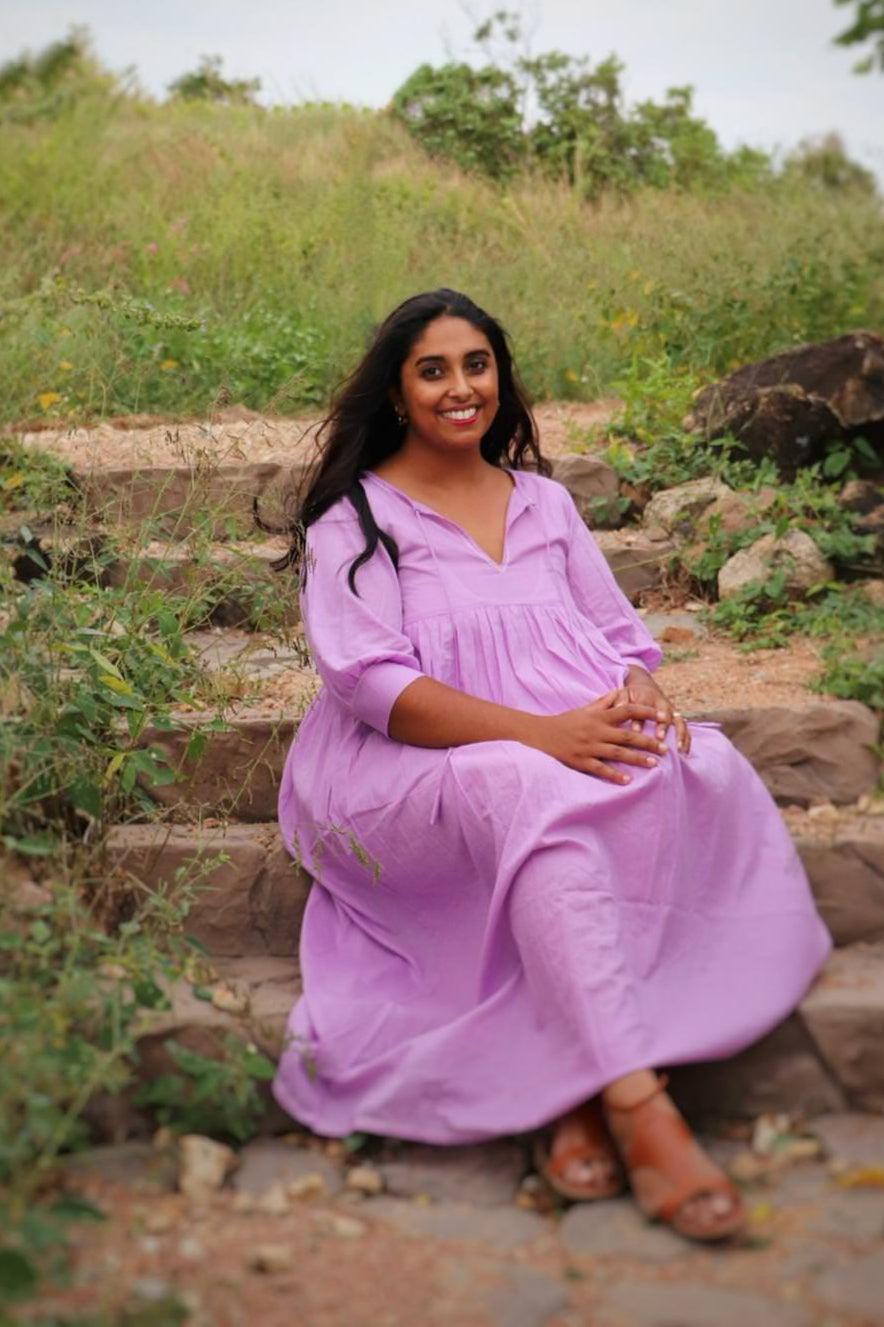 Woman wearing lavender mulmul cotton midi dress