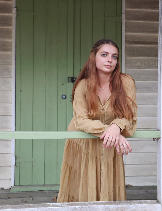 Woman wearing mustard mulmul cotton maxi dress